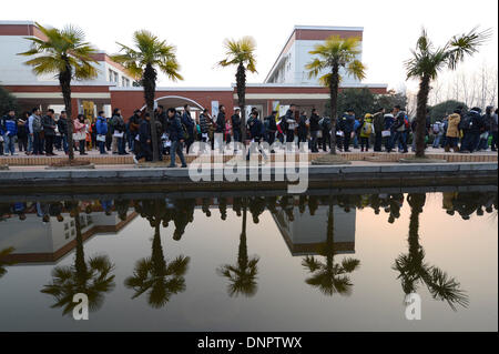 Hefei, China's Anhui Province. 4th Jan, 2014. Students queue to enter an examination place in Hefei, east China's Anhui Province, Jan. 4, 2014. The 3-day national postgraduate exam of 2014 began on Saturday. Credit:  Zhang Duan/Xinhua/Alamy Live News Stock Photo