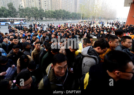 Hefei, China's Anhui Province. 4th Jan, 2014. Students enter an examination place in Hefei, east China's Anhui Province, Jan. 4, 2014. The 3-day national postgraduate exam of 2014 began on Saturday. Credit:  Zhang Duan/Xinhua/Alamy Live News Stock Photo