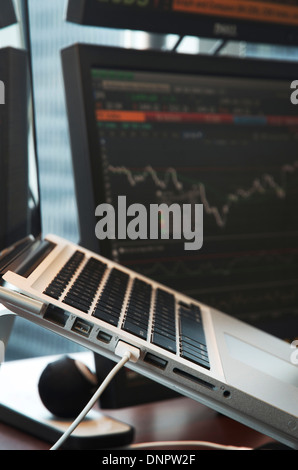 Close-up of Laptop Computer and Computer Monitors in Office Stock Photo