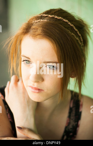 Portrait of teenage girl outdoors, looking into the distance Stock Photo