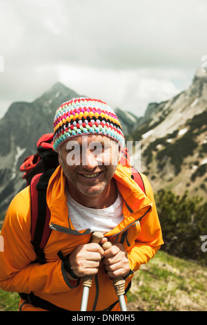 Close-up portrait of mature man hiking in mountains, Tannheim Valley, Austria Stock Photo