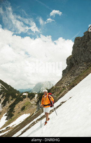 Mature man hiking in mountains, Tannheim Valley, Austria Stock Photo