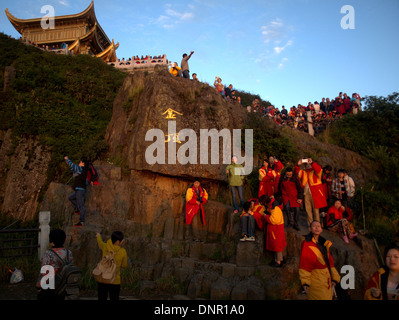 Sunrise dawn temples at the Golden summit of Mount Emei, Emei Shan, near Leshan, Sichuan province, China. Stock Photo