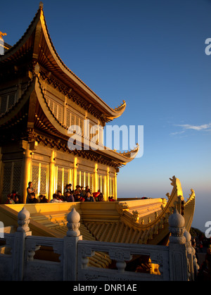 Sunrise dawn temples at the Golden summit of Mount Emei, Emei Shan, near Leshan, Sichuan province, China. Stock Photo