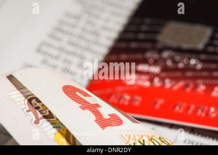 Credit cards and banknotes on newspaper.Macro shot