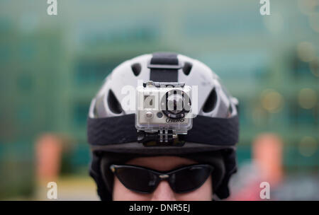 Hanover, Germany. 04th Jan, 2014. ILLUSTRATION - An illustration shows a man wearing a ski hemlet with with GoPro brand camera attached to it in Hanover, Germany, 04 January 2014. The camera, which can be worn on the helmet, can make high-resolution videos and photos. Photo: JULIAN STRATENSCHULTE/dpa/Alamy Live News Stock Photo