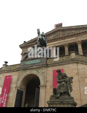 White sky portrait looking up to equestrian statue Frederick William IV, top of entrance stairs to Alte Nationalgalerie, Berlin Stock Photo