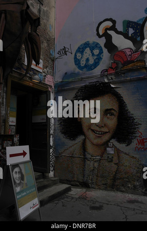 Portrait of large smiling image Ann Frank painted on wall at the entrance to the Ann Frank Zentrum, Rosenthaler Strasse, Berlin Stock Photo