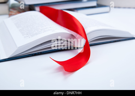 open book whith red ribbon bookmark Stock Photo - Alamy