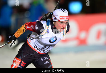 Oberhof, Germany. 04th Jan, 2014. German biathlete Andrea Henkel races towards the finish line in the women's 10 kilometer pursuit at the biathlon world cup at the DKB ski arena in Oberhof, Germany, 04 January 2014. Photo: MARTIN SCHUTT/dpa/Alamy Live News Stock Photo