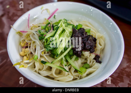 Bowl of Noodles with Soy Bean Paste in Bejing, China Stock Photo