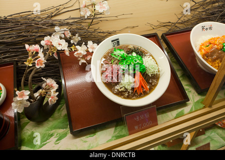 Plastic food model (iced buckwheat noodles) display case at fast food restaurant - Seoul, South Korea Stock Photo