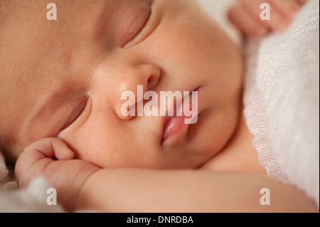 Sleeping newborn baby face. Stock Photo