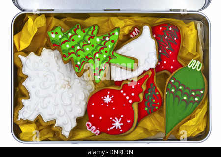 Iced Christmas cookies in tin box isolated on white. Stock Photo