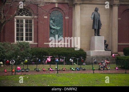 row of kids scooters parked in front of Plymouth Church in Brooklyn NYC Stock Photo