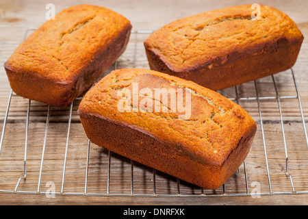 three loafs of freshly baked gluten free bread prepared with coconut and almond flour, flaxseed meal with sesame seeds Stock Photo