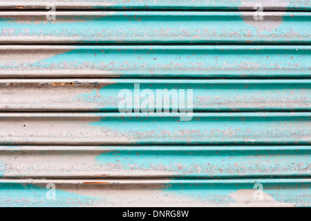 Blue rusty corrugated metal sheet as a background Stock Photo