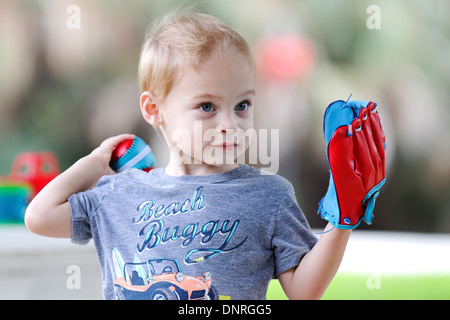 Young boy playing baseball Stock Photo