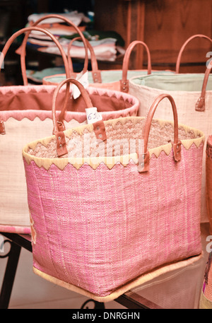 Selection of hand made shopping bags for sale at a market stall Stock Photo