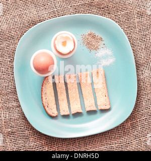 Boiled eggs and toast fingers on a plate Stock Photo