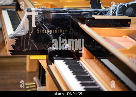 Bayreuth, Germany. 12th Dec, 2013. Two pianos sit in the tuning workshop of piano maker Steingraeber & Soehne in Bayreuth, Germany, 12 December 2013. The family company has been making pianos since 1852 in Bayreuth. Photo: David Ebener/dpa/Alamy Live News Stock Photo