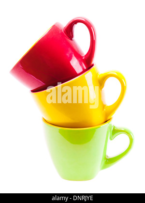 Beautiful yellow, red, green color cups. Tower stack of clean different cups isolated on white background Stock Photo