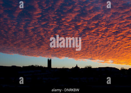 Warwick, Warwickshire, UK. 5th Jan, 2014. A dramatic dawn sky over Warwick town centre. The clear sky came after days of stormy weather across the UK. Credit:  Colin Underhill/Alamy Live News Stock Photo