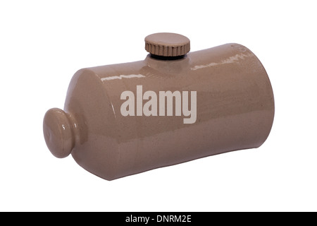 An old fashioned stone hot water bottle bed warmer on a white background Stock Photo