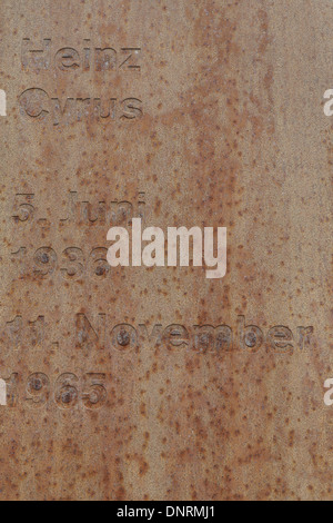 Name and dates of victim Heinz Cyrus inscribed on back of brown metal information panel, Berlin Wall Memorial, Gartenstrasse Stock Photo