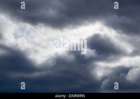 Rain cloud with sunbeam Stock Photo
