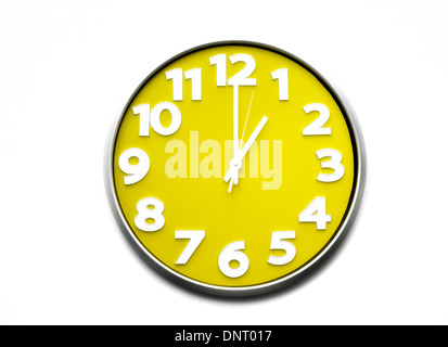 yellow clock face 1 o'clock the clock strikes one 1300 hours Stock Photo