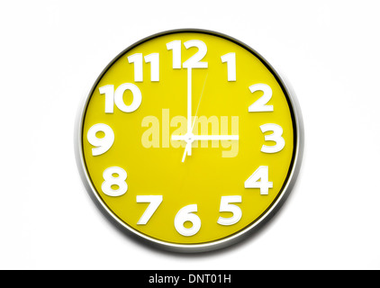 yellow clock face 3 o'clock the clock strikes three 1500 hours Stock Photo