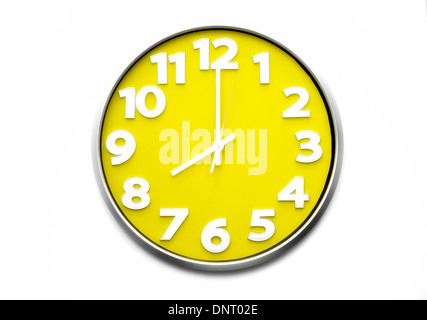 yellow clock face 8 o'clock the clock strikes eight 20.00 hours Stock Photo