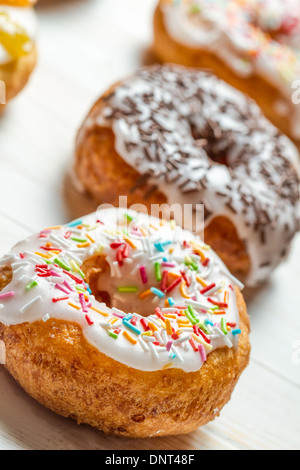 Closeup of freshly baked colorful donuts Stock Photo - Alamy