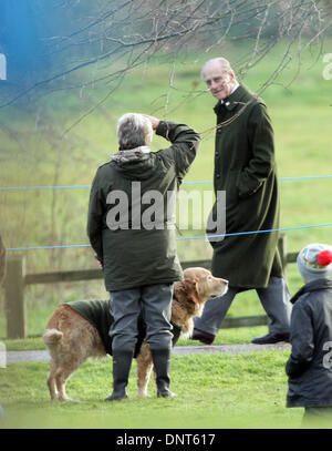 Sandringham, Norfolk, UK. 5th Jan, 2014. HM Queen Elizabeth II attends Church at Sandringham.   Prince Philip, Duke of Edinburgh looks as someone standing with their dog salutes him after the St. Mary Magdalene Church Sunday morning service in Sandringham. Pic: Paul Marriott Photography/Alamy Live News Stock Photo