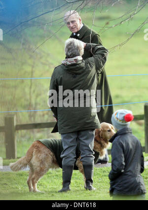 Sandringham, Norfolk, UK. 5th Jan, 2014. HM Queen Elizabeth II attends Church at Sandringham.   Prince Philip, Duke of Edinburgh looks as someone standing with their dog salutes him after the St. Mary Magdalene Church Sunday morning service in Sandringham. Pic: Paul Marriott Photography/Alamy Live News Stock Photo