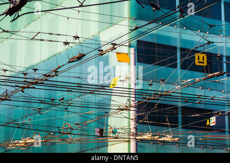 Chaotic intersection of electric tram power cables in downtown Geneva, Switzerland Stock Photo