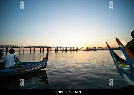 MANDALAY, MYANMAR - NOVEMBER 6; Tourists watch the sun set over the U Bein Bridge on November 6Myanmar travel and people images. Stock Photo