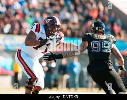 Dec. 30, 2013 - El Paso, TX, United States of America - December 31, 2013 El Paso, TX...Virginia Tech offensive lineman (71) Jonathan McLaughlin battles UCLA defensive end (99) Cassius Marsh during the UCLA vs Virginia tech football game. The UCLA Bruins defeated the Virginia Tech Hokies 42-12 on Tuesday, December 31, 2013 in the Hyundai Sun Bowl in El Paso, TX. (Mandatory Credit: Juan Lainez / MarinMedia.org / Cal Sport Media) (Complete photographer, and credit required) Stock Photo