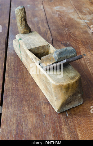 weathered vintage wooden plane on table top Stock Photo