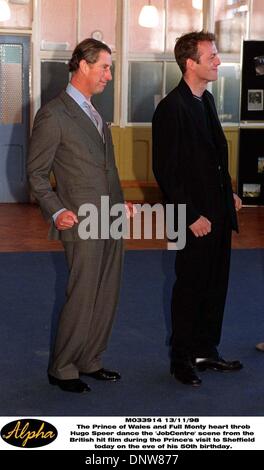 Nov. 13, 1998 - Sheffield, Great Britain - The Prince of Wales and Full Monty heart throb Hugo Speer dance the 'JobCentre' scene from the British hit film during the Prince's visit to Sheffield today (Friday) on the eve of his 50th birthday(Credit Image: © Globe Photos/ZUMAPRESS.com) Stock Photo