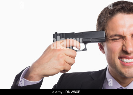 Close-up of a businessman holding a gun to head Stock Photo