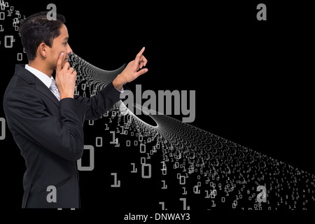 Composite image of thoughtful asian businessman pointing Stock Photo