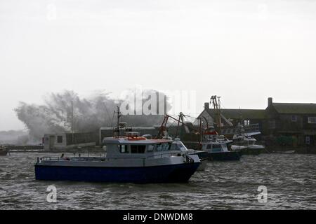 Lyme Regis, Dorset, UK, 6th January 2014: As high winds and huge waves continue to batter the South West. Dorset Police warn people to stay away from coastal areas in wet and windy conditions. Credit:  Tom Corban/Alamy Live News Stock Photo