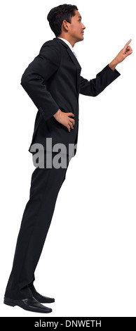 Unsmiling asian businessman pointing Stock Photo