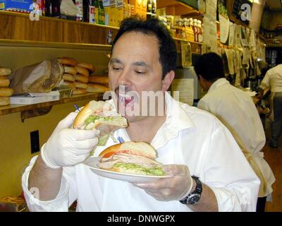 Feb. 22, 2002 - Great Neck, NY, USA - 2/22/02 Great Neck L.I. Sarah Sandwich Larry Siele, of the ''Deli on the Green'' a local eatery frequented by the Hughes family in their home town of Great Neck L.I. with the ''Golden Sarah Hughes Special'' sandwich that the gold medalist orders. It's swiss cheese, maple ham, lettuce & tomato with thousand island dressing on a golden roll. ( Ne Stock Photo