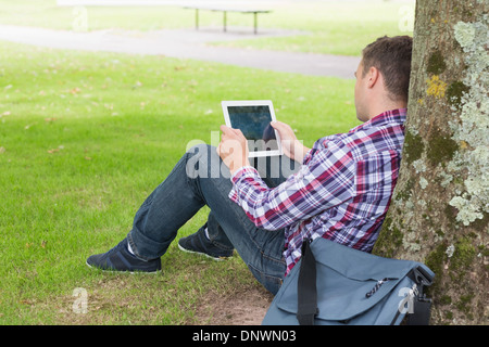 Student using his tablet pc outside Stock Photo