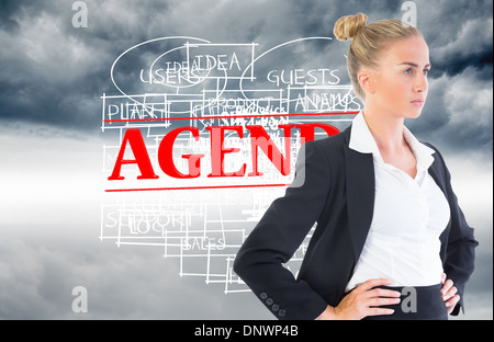 Composite image of businesswoman standing with hands on hips Stock Photo