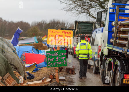 Barton Moss, UK. 6th Jan, 2014. The Anti Fracking camp at Barton Moss, as police search tents after reports that a flare is fired towards a police helicopter Credit:  Steven Purcell/Alamy Live News Stock Photo