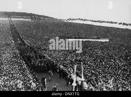 Oct. 21, 1934 - Buckeberg, Germany - Nazi party holds a mass meeting in Buckeberg in 1934. Nazi officials walk behind ADOLF HITLER, who is saluted by a crowd of thousands of people. (Credit Image: © KEYSTONE Pictures USA/ZUMAPRESS.com) Stock Photo